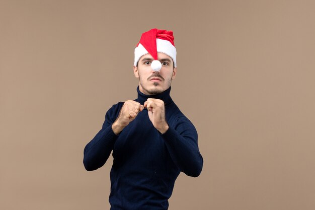 Front view young male with angry expression on brown desk emotion christmas holiday