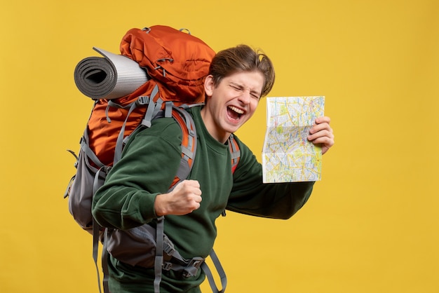 Front view young male with backpack holding map