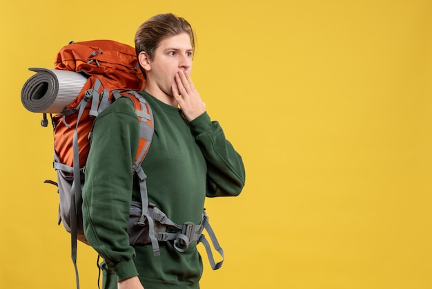 Front view young male with backpack preparing for hiking