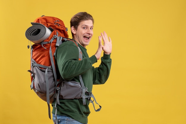 Front view young male with backpack preparing for hiking