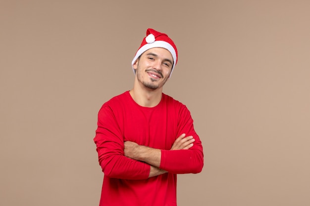 Front view young male with excited expression on brown background emotion holiday color male