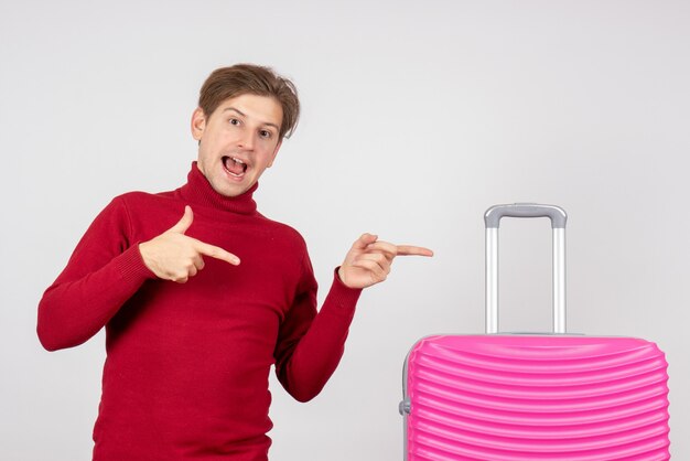 Front view young male with pink bag on the white background