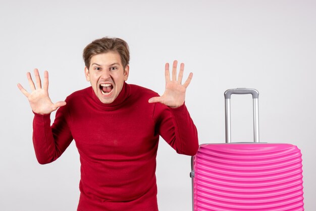 Front view young male with pink bag on white background