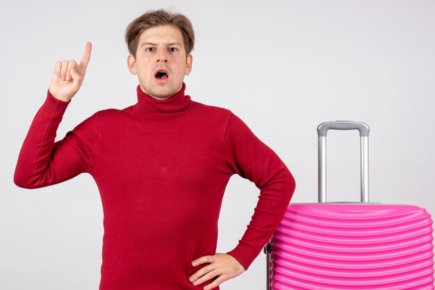 Front view young male with pink bag on white background