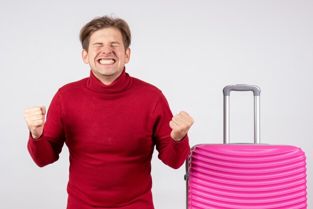 Front view young male with pink bag on white background