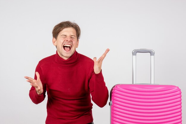 Front view young male with pink bag on white background