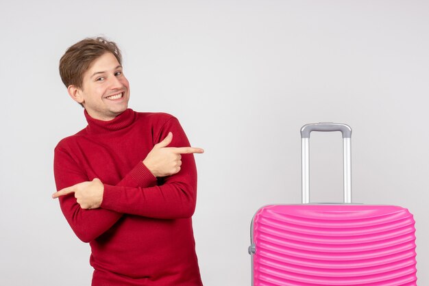 Front view young male with pink bag on white background