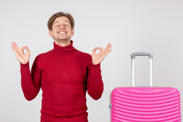 Front view young male with pink bag on white background