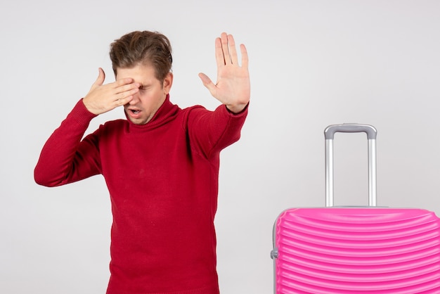 Front view young male with pink bag on white background