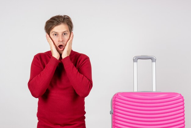 Front view young male with pink bag on white background