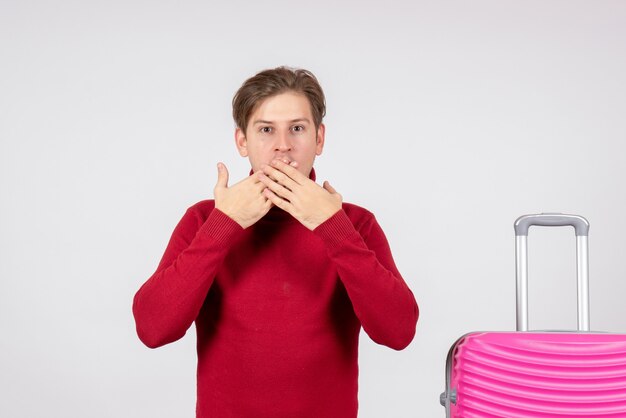 Front view young male with pink bag on white background