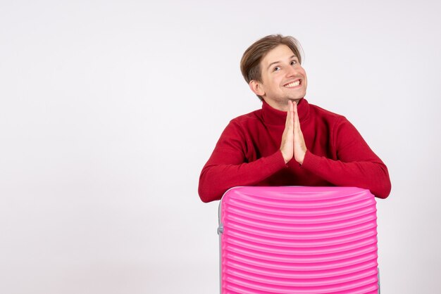 Front view young male with pink bag on white background