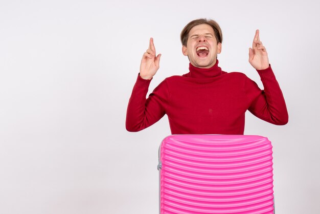 Front view young male with pink bag on white background