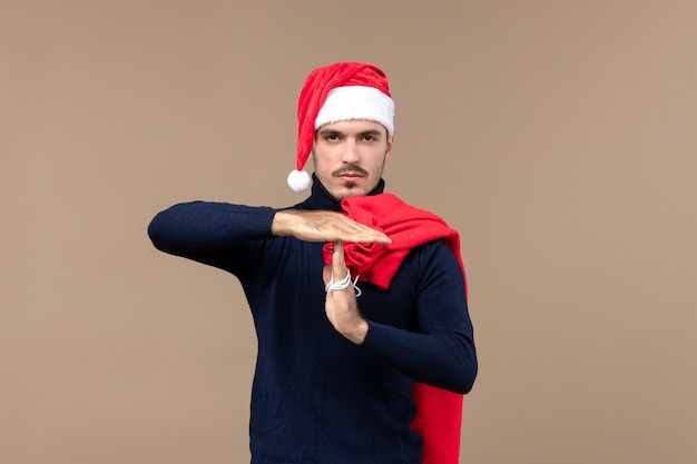 Front view young male with present bag, christmas holiday santa