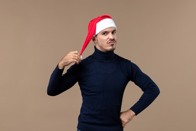 Front view young male with red christmas cap, eve holiday christmas