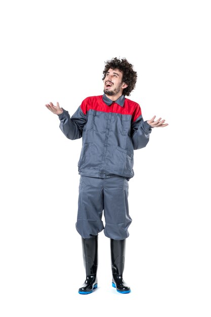 front view young male worker in uniform cheerful on white background