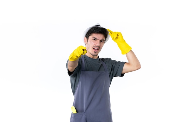 Front view young male in yellow gloves on the white background flower bush plant job garden grass tree gardener green