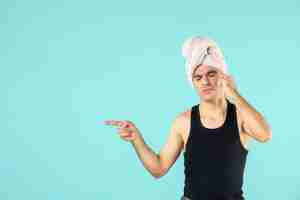 Free photo front view of young man after shower on blue wall