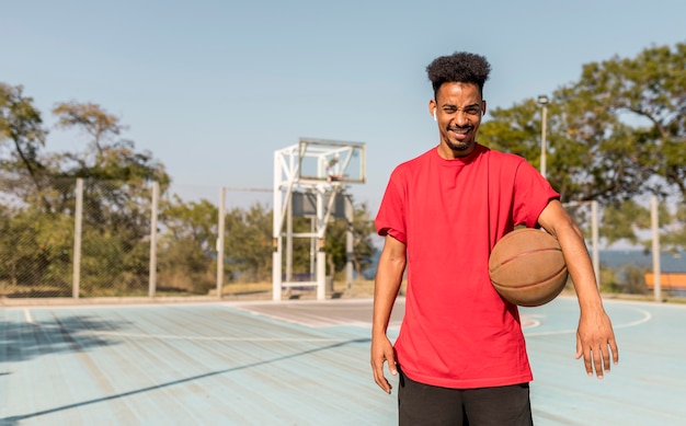 Front view young man on a basketball field