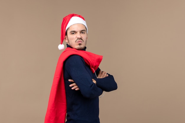 Front view young man carrying present bag, santa holiday christmas