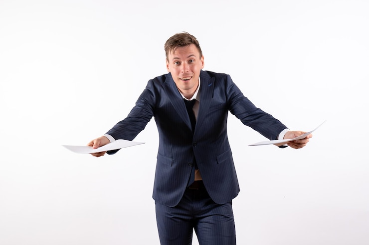 Free Photo front view young man in elegant classic suit holding documents on white background