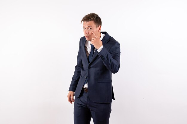 Front view young man in elegant classic suit on white background