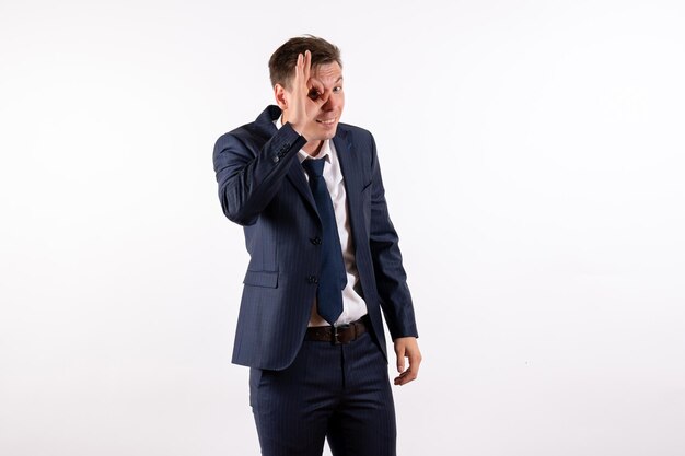 Front view young man in elegant classic suit on white background