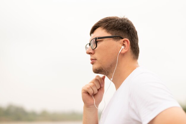 Front view of a young man looking away