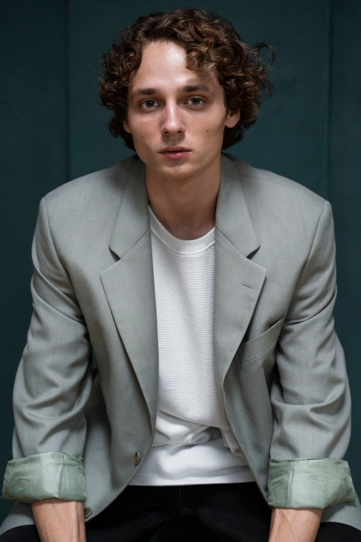 Free Photo front view young man posing indoors