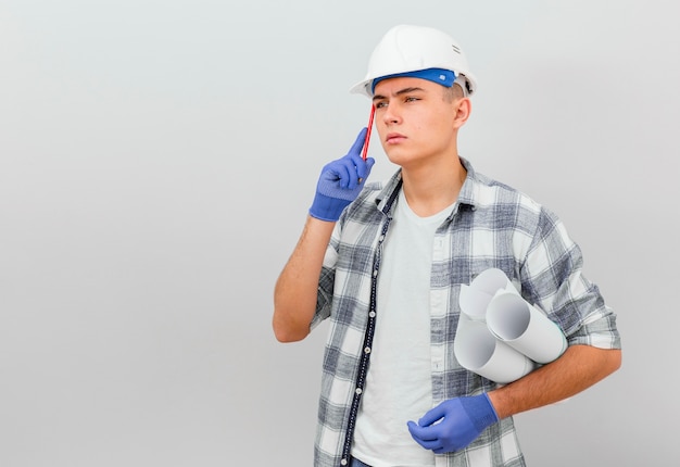 Front view of young man thinking with copy space