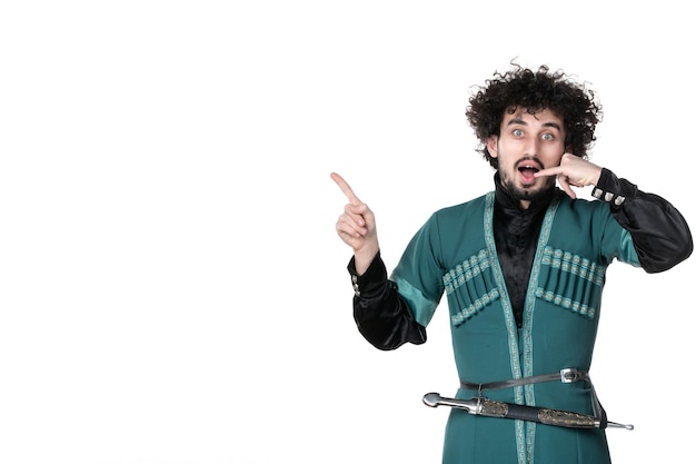 Front view of young man in traditional azerbaijani costume imitating phone call on white background novruz concept spring colours ethnicity horizontal dancer performer