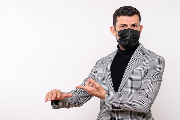 Free photo front view young man with black mask standing on white isolated background