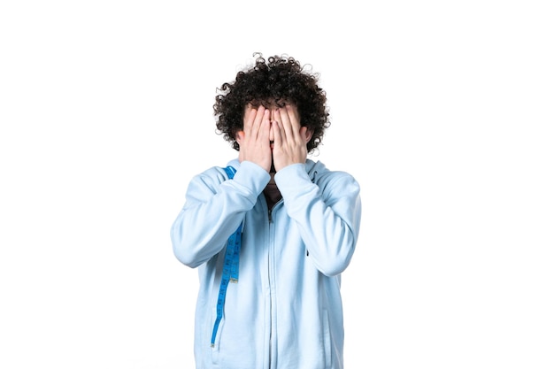 Front view young man with measure tape on white surface