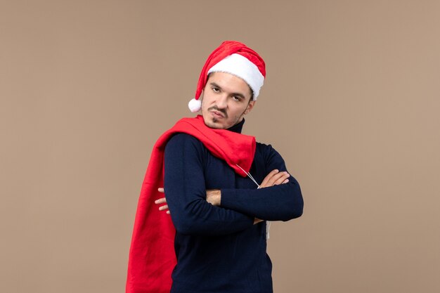 Front view young man with present bag, santa holidays christmas