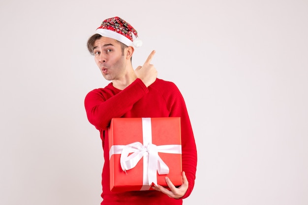 Front view young man with santa hat standing on white background with copy space