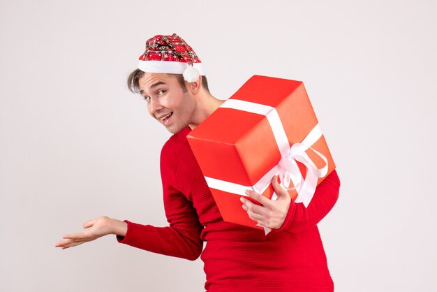 Front view young man with santa hat standing on white background