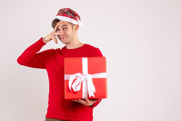 Front view young man with santa hat standing on white background