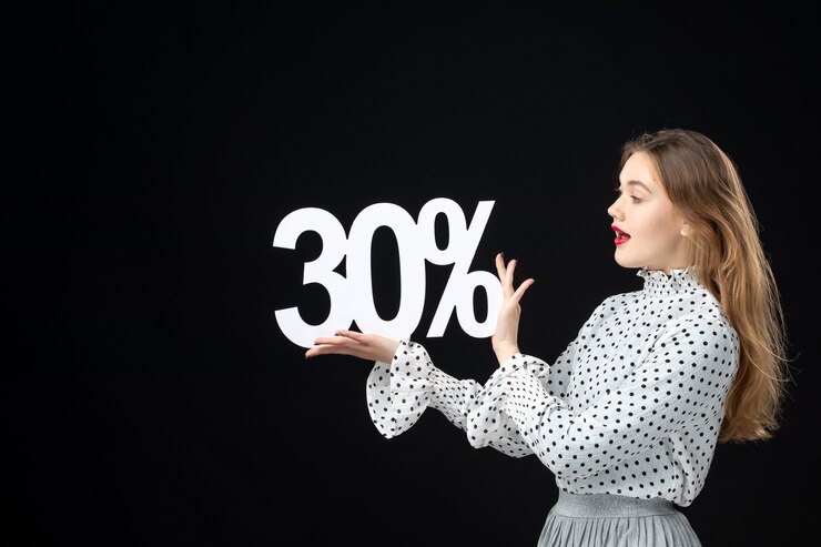 Free Photo front view young pretty female holding on black wall color shopping emotion xmas model beauty