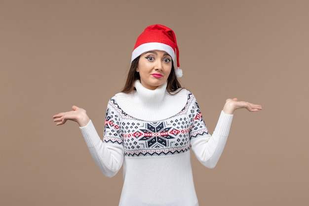 Front view young woman on brown background new year emotions christmas