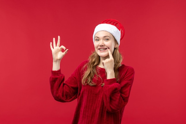 Front view young woman happily smiling, christmas holiday red
