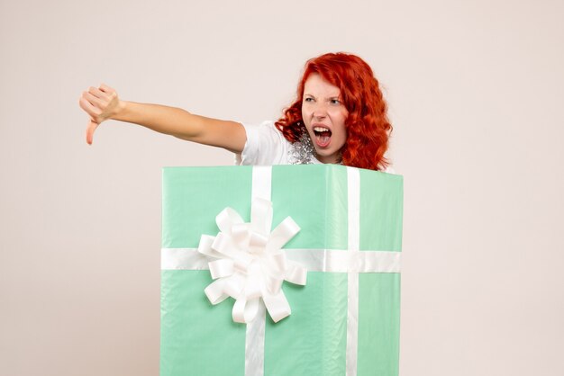 Front view young woman inside present on white background