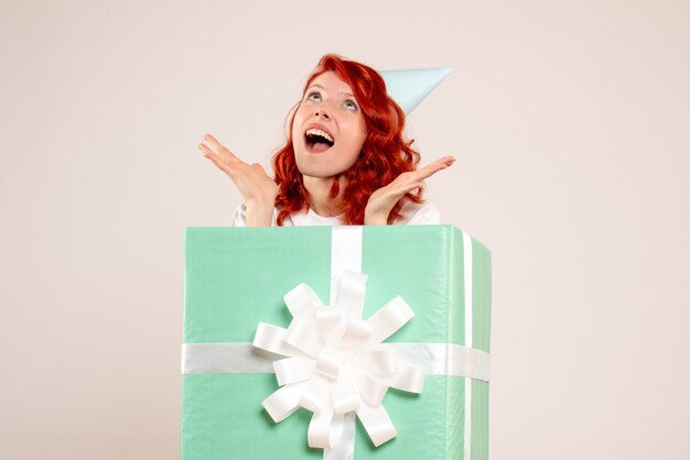 Front view young woman inside present on white background