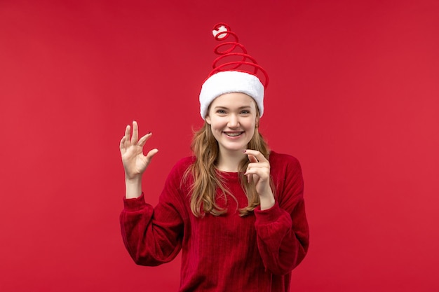 Free photo front view young woman laughing, christmas holiday red