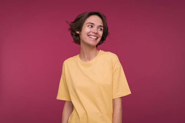 Free photo front view of a young woman looking away and smiling