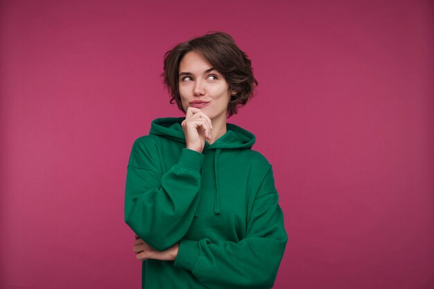 Front view of a young woman looking mischievous