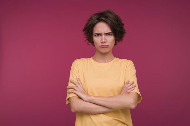 Front view of a young woman looking upset