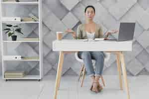 Free photo front view young woman at office