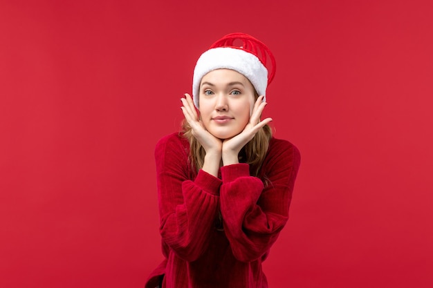 Front view young woman posing, christmas holiday red