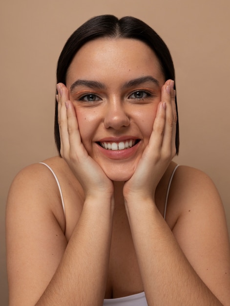 Front view young woman posing in studio