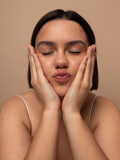 Front view young woman posing in studio